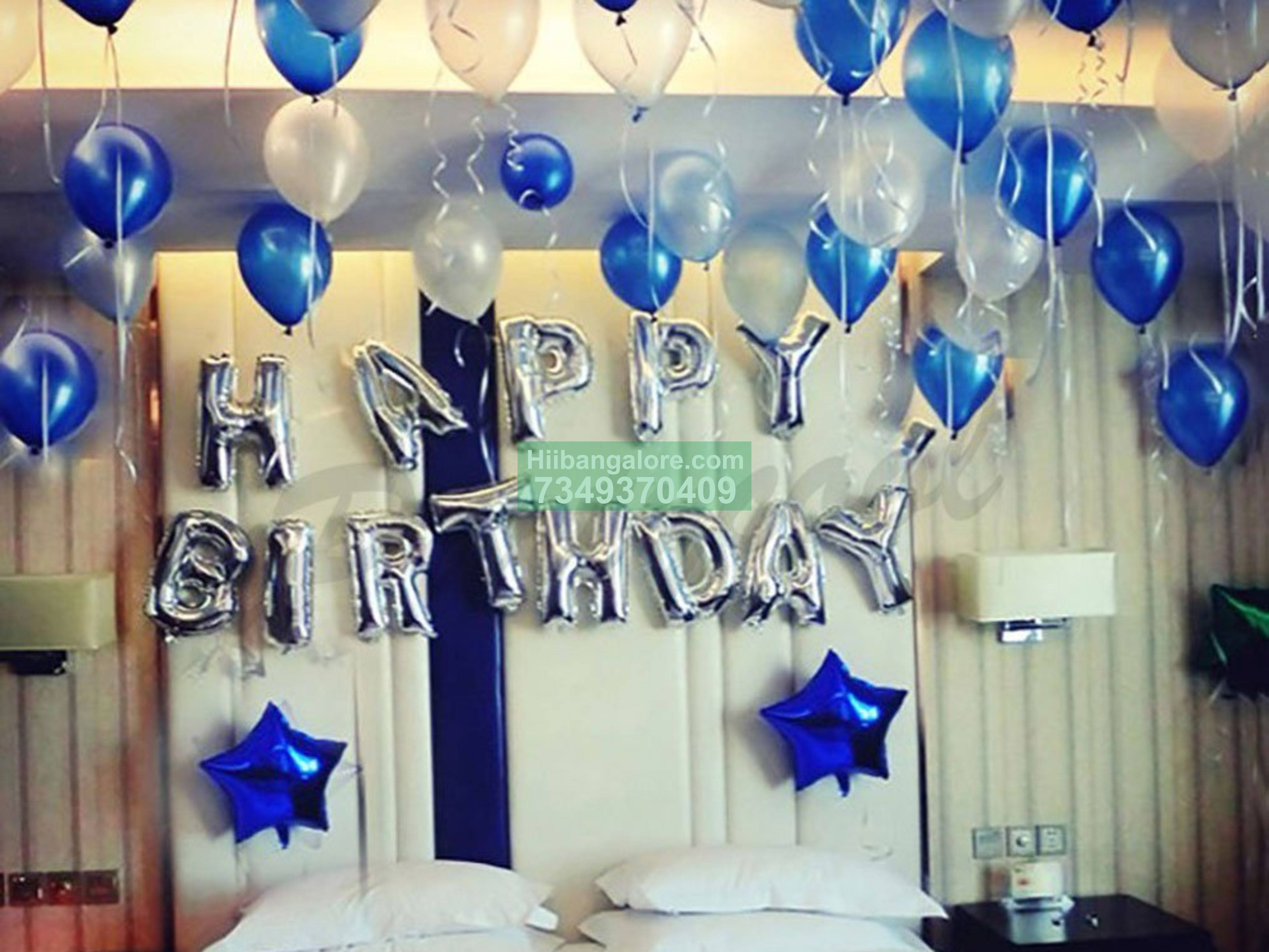 Blue and white home balloon decor with star foil balloons Bangalore