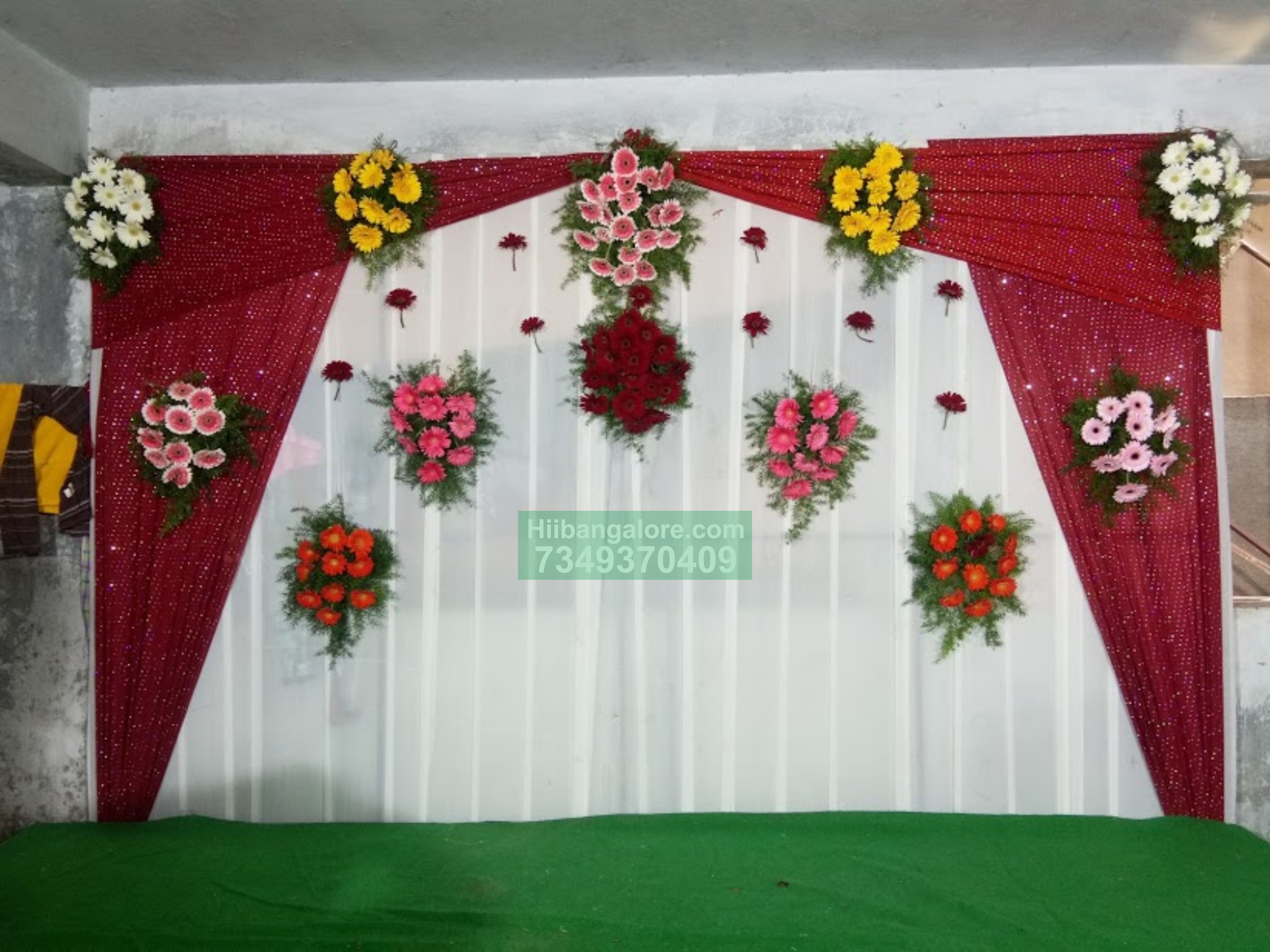 Maroon curtain backdrop engagement floral decor Bangalore