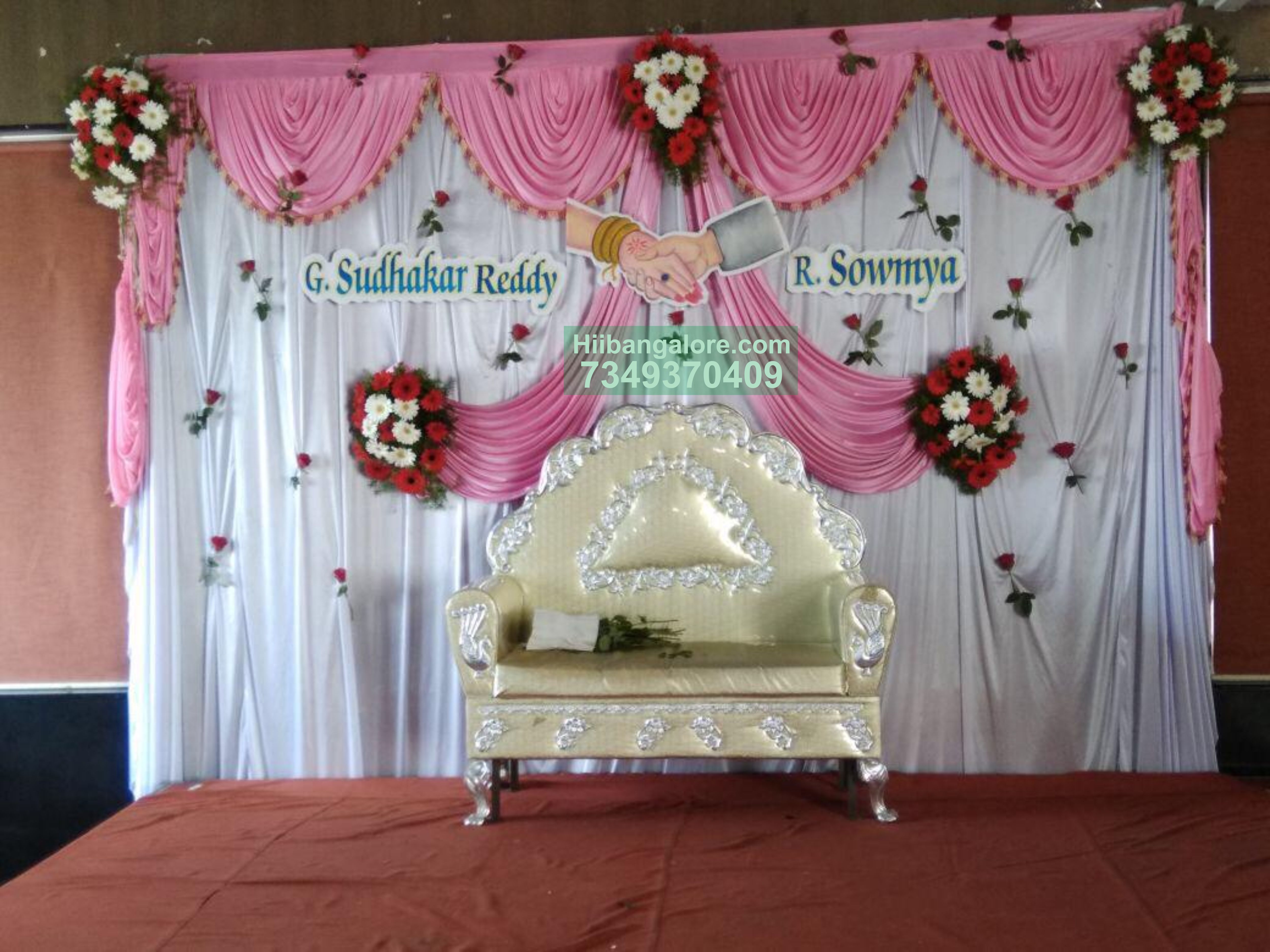 Pink backdrop with red flower decoration for engagement Bangalore