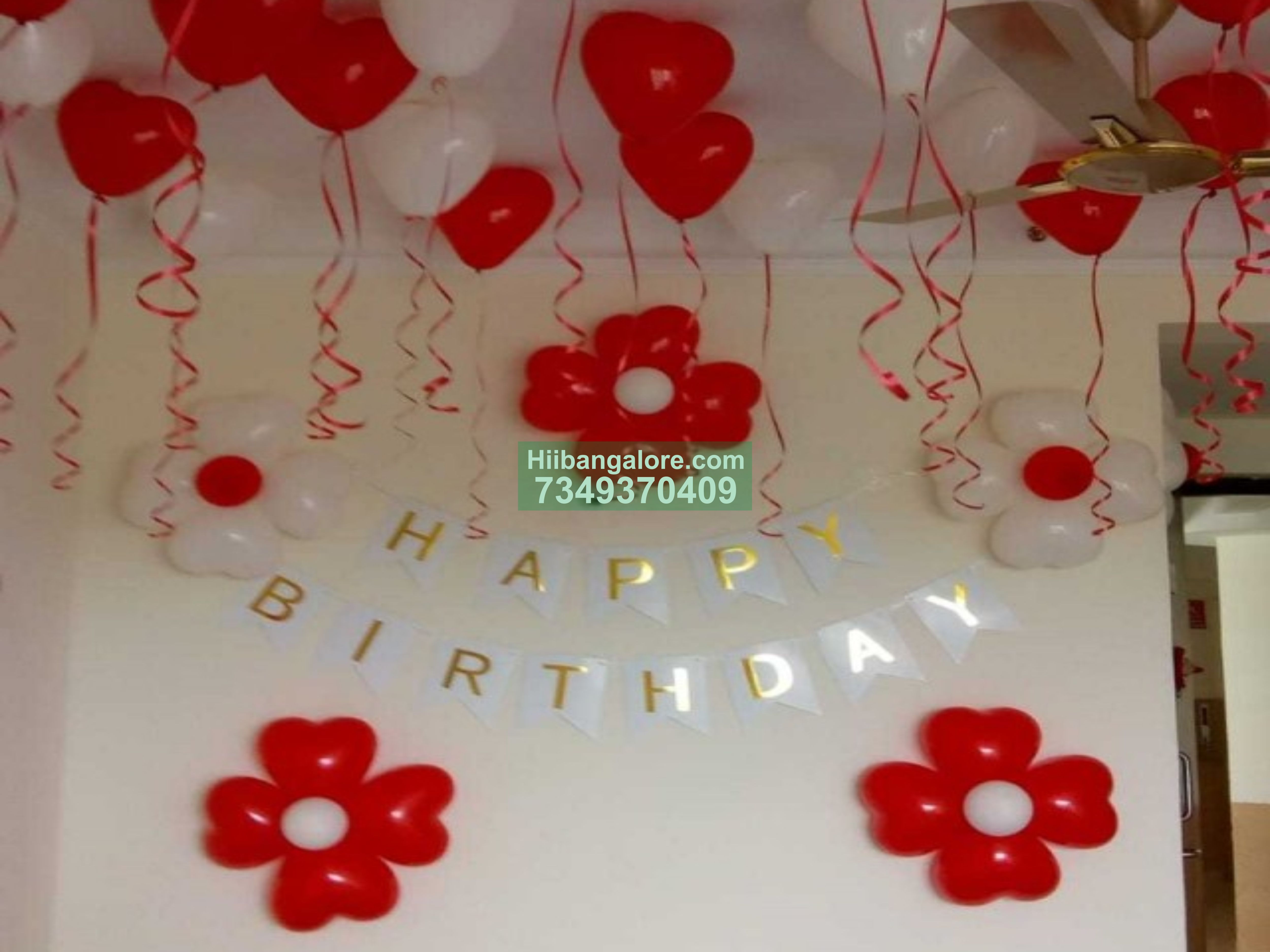 Red and white balloon decoration at home with balloon flowers Bangalore