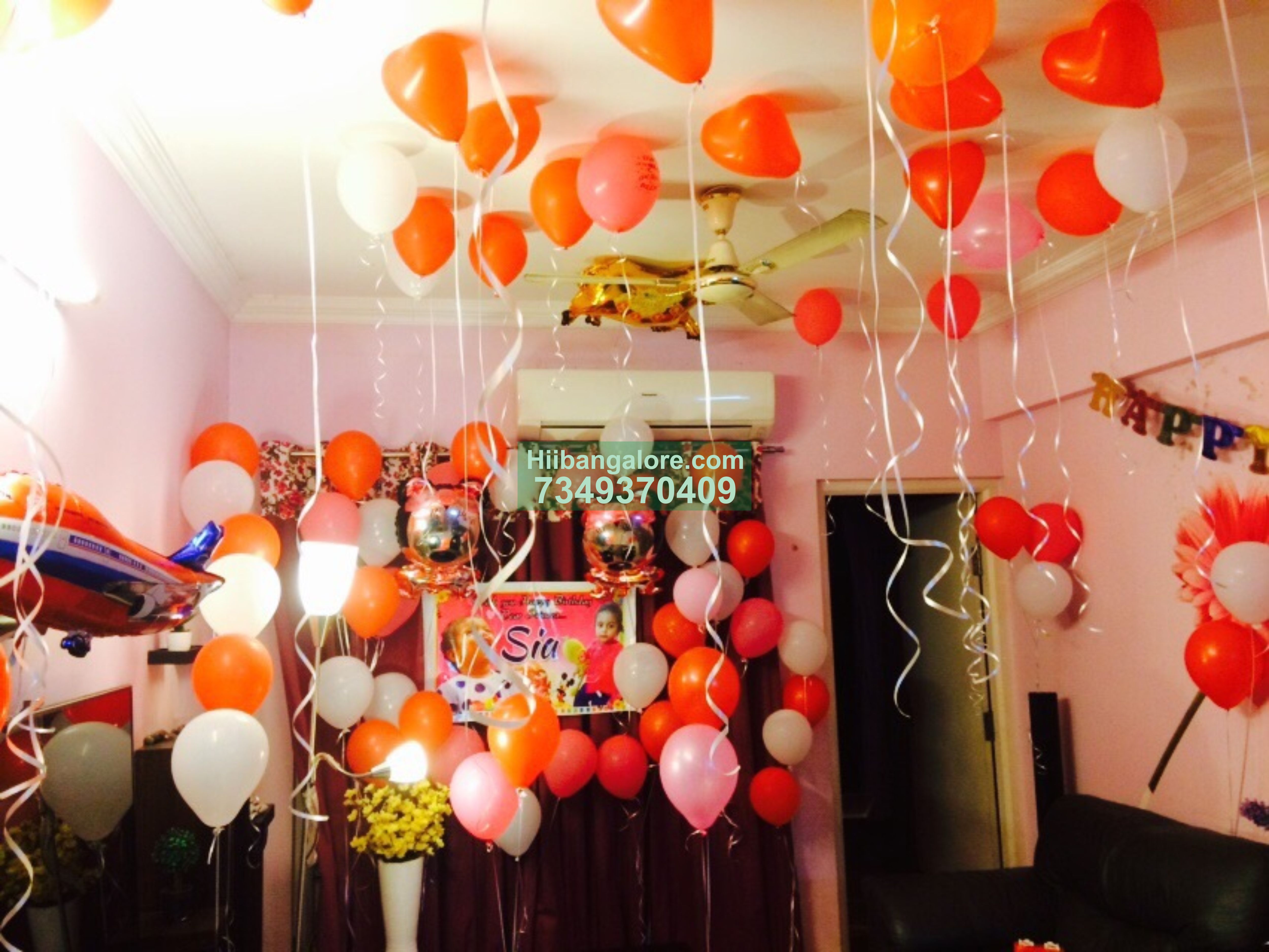 Red and white balloon decoration at home Bangalore