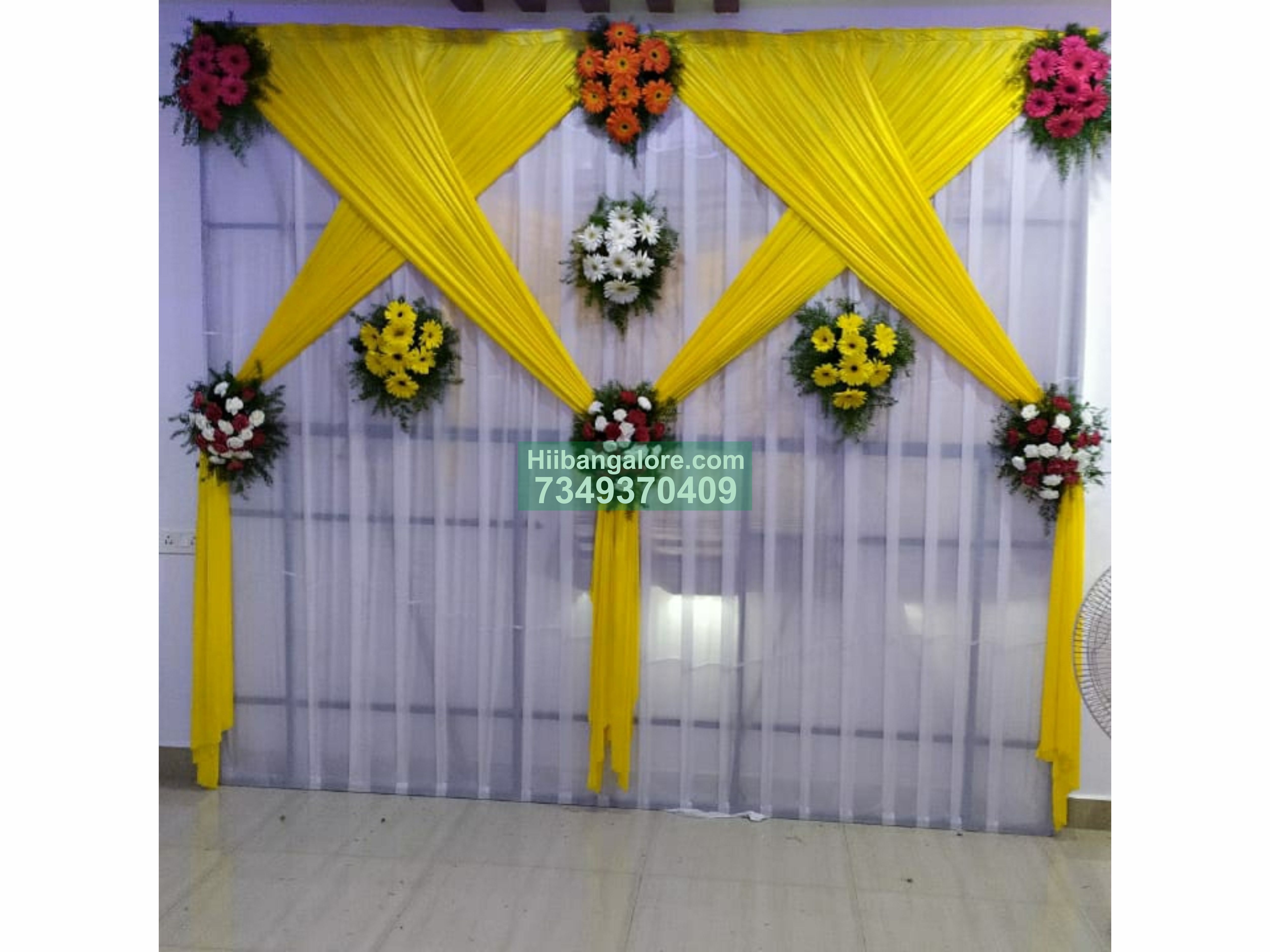 Simple yellow and white engagement decoration at home Bangalore