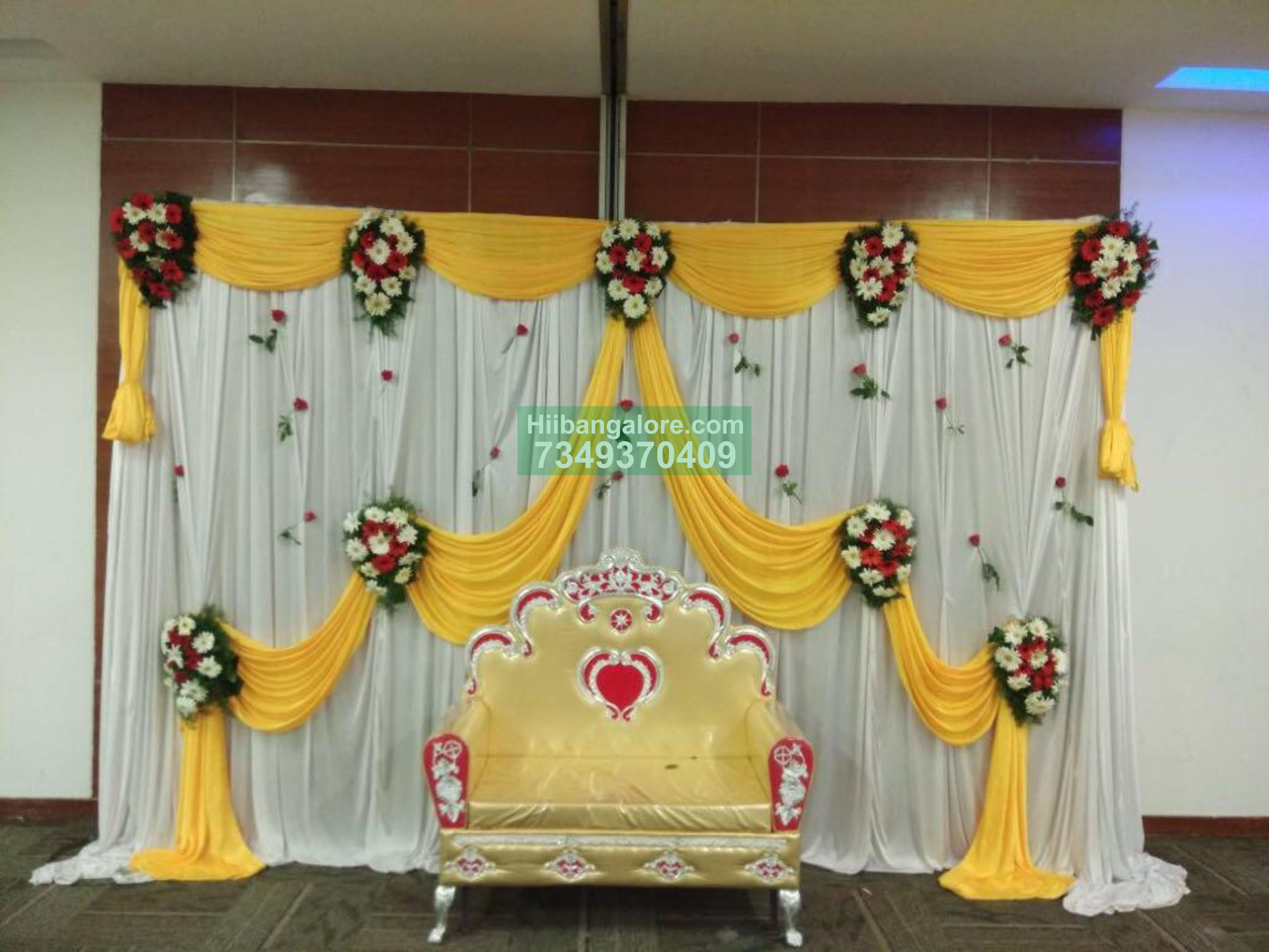 Simple yellow drapes flower decoration for engagement Bangalore