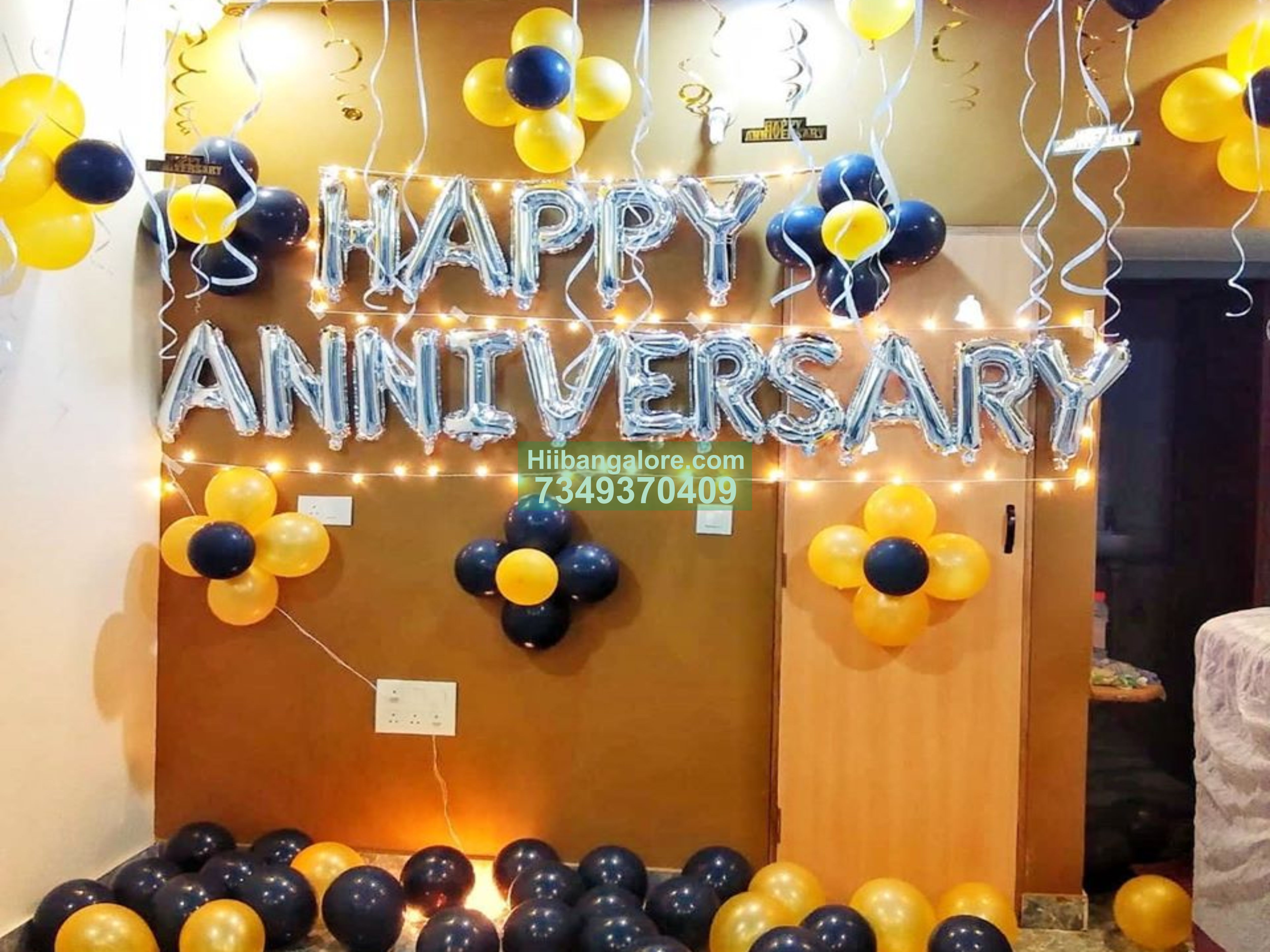 anniversary balloon decoration at home with black and yellow balloons Bangalore