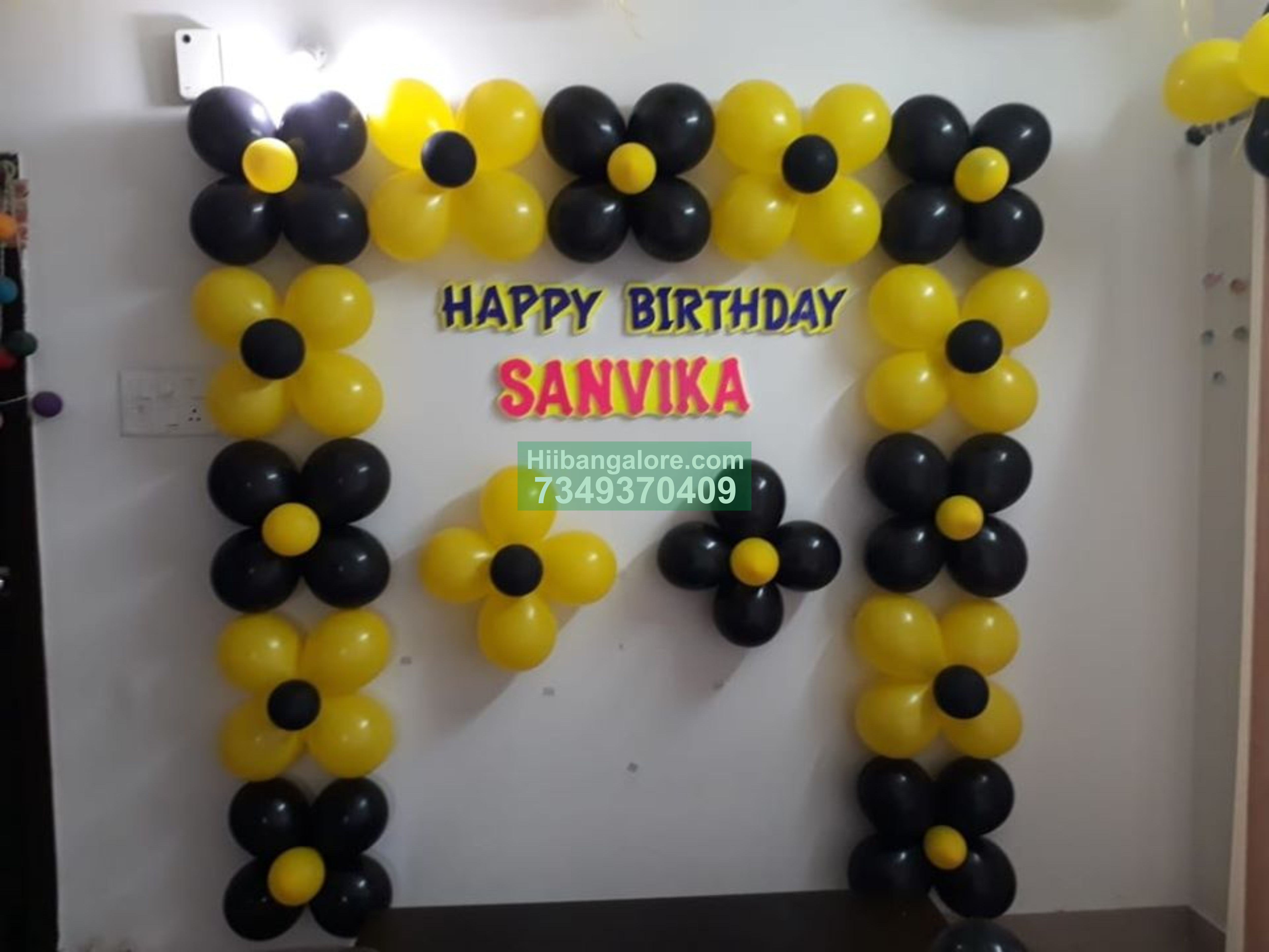 balck and yellow birthday balloon decoration at home Bangalore