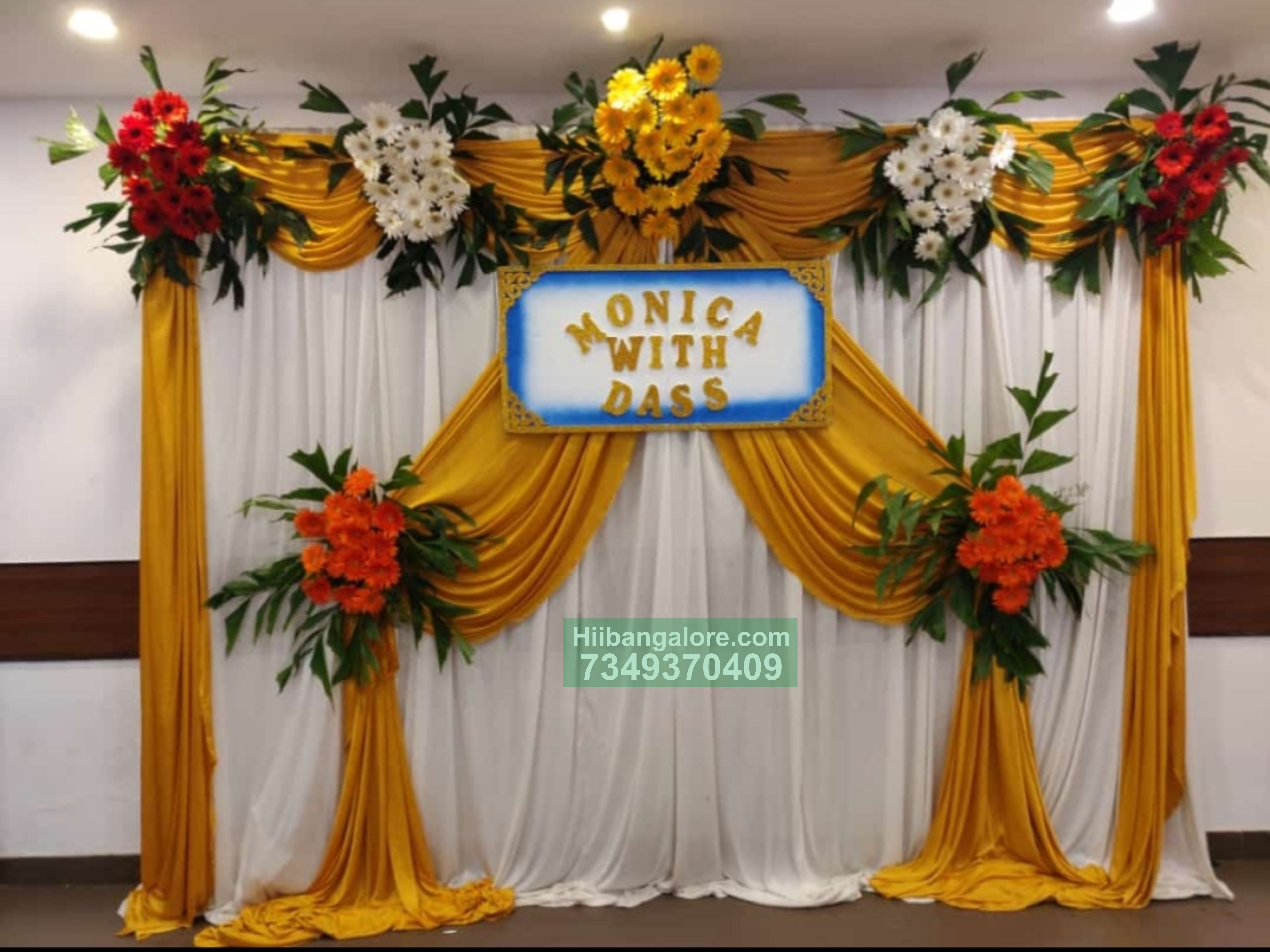 gold and white backdrop flower decoration for engagement Bangalore