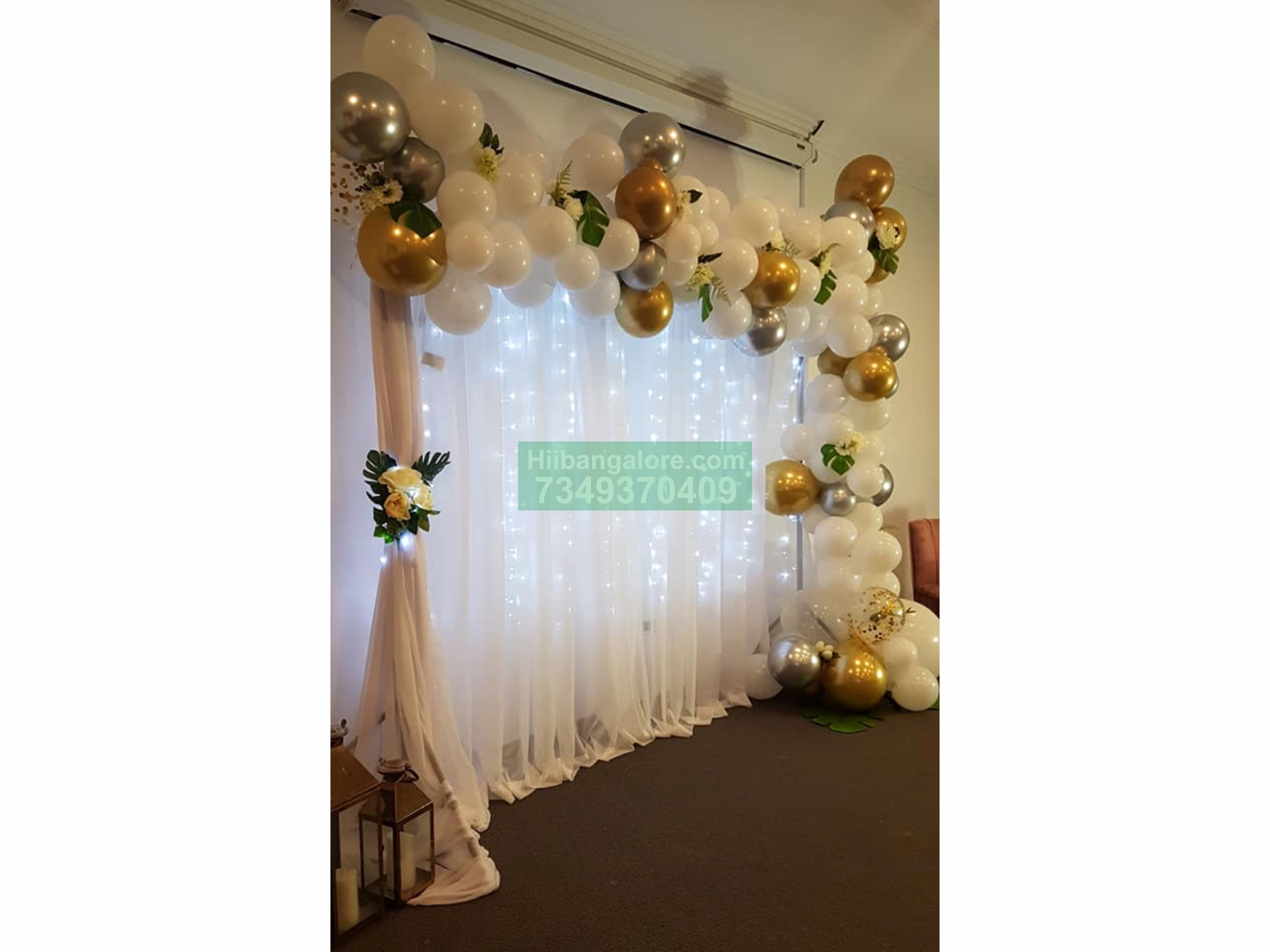 white backdrop and organic balloon arc decoration for engagement Bangalore