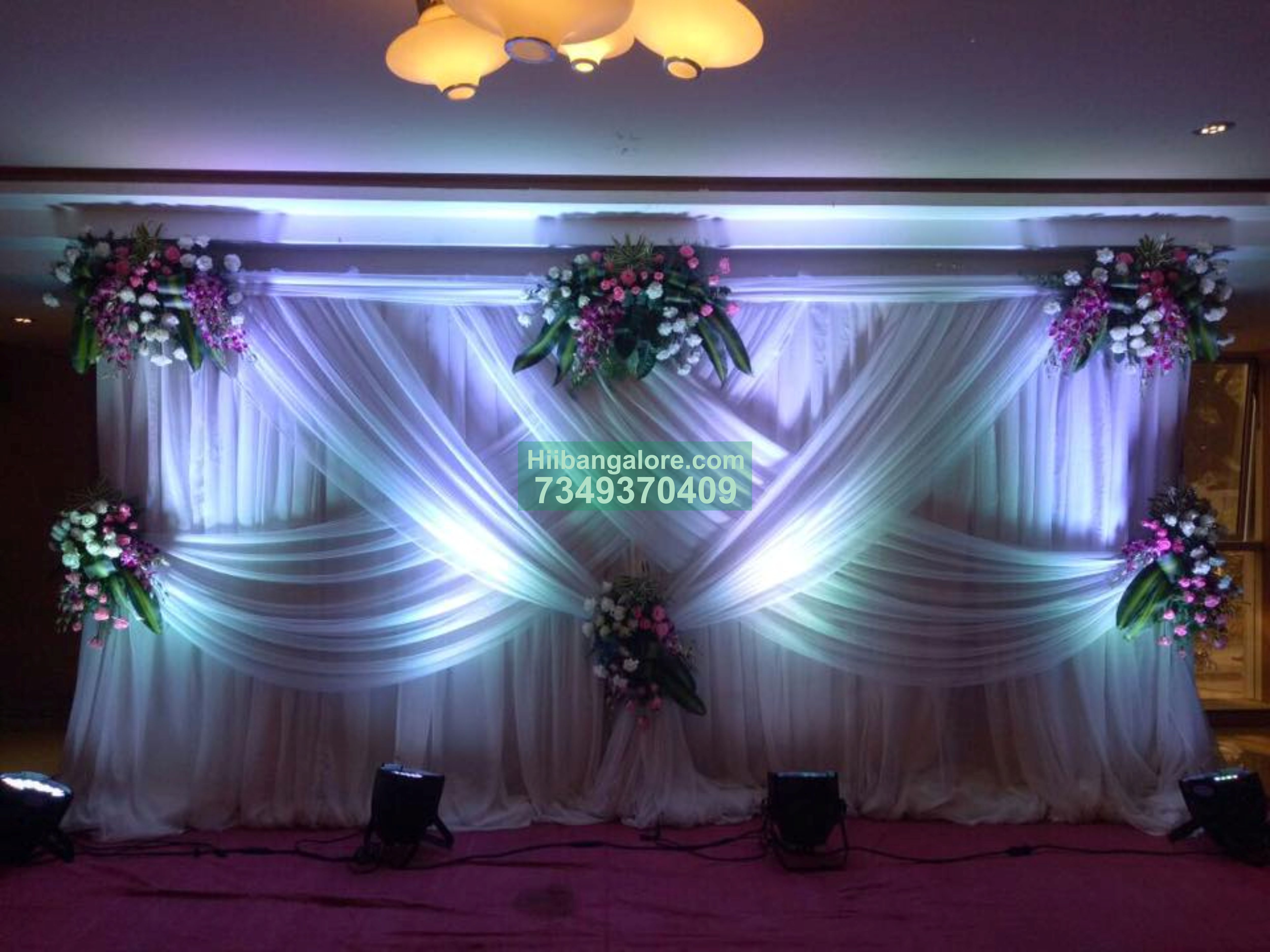 white backdrop orchid floral decoration for engagement - Best Birthday  Party Organisers, Balloon decorators, Birthday party Caterers in Bangalore