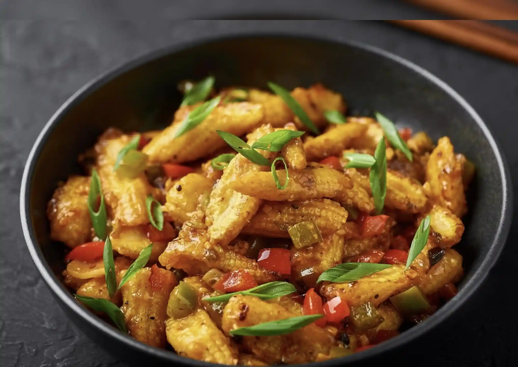 Baby corn manchurian tossed with spices and herbs