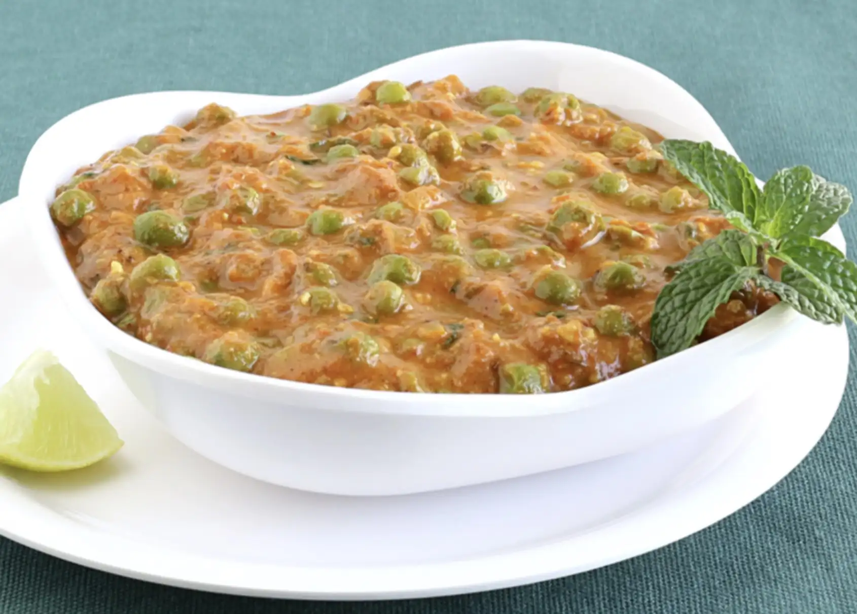 Batani curry prepared in Andhra style for veg catering services in Bangalore