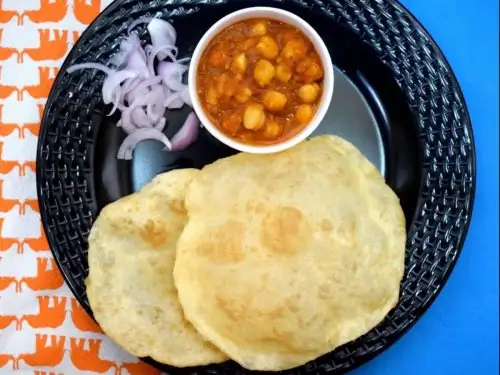 Chola battura served with curry in andhra style catering