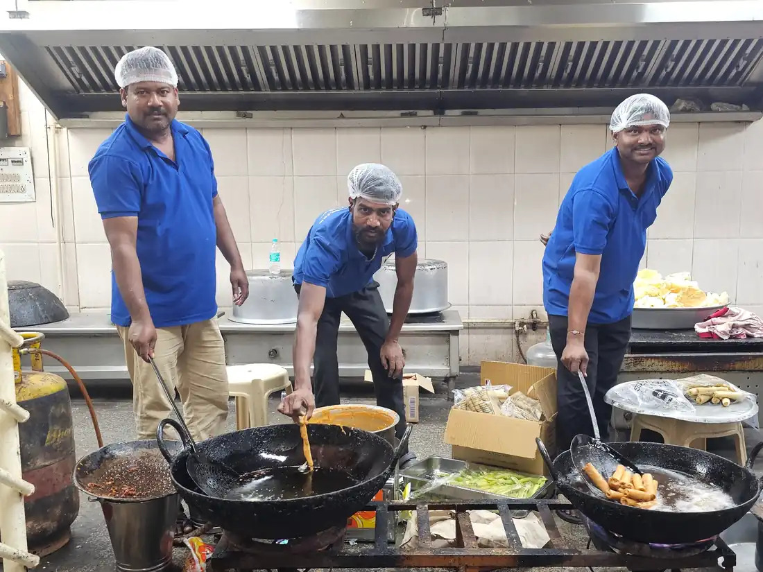 Authentic Andhra cooks preparing traditional food for catering events