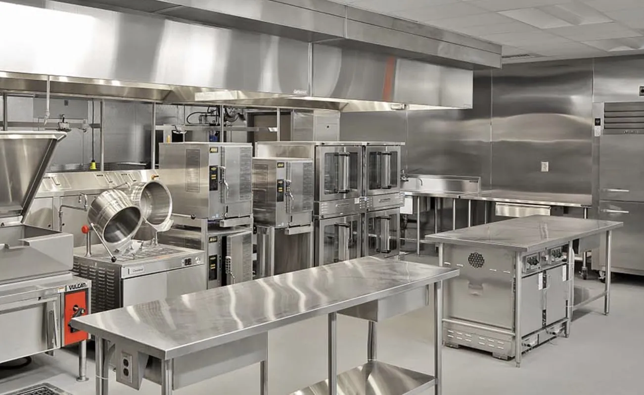 Hygienic Andhra style catering kitchen in Bangalore with stainless steel equipment and professional food preparation setup