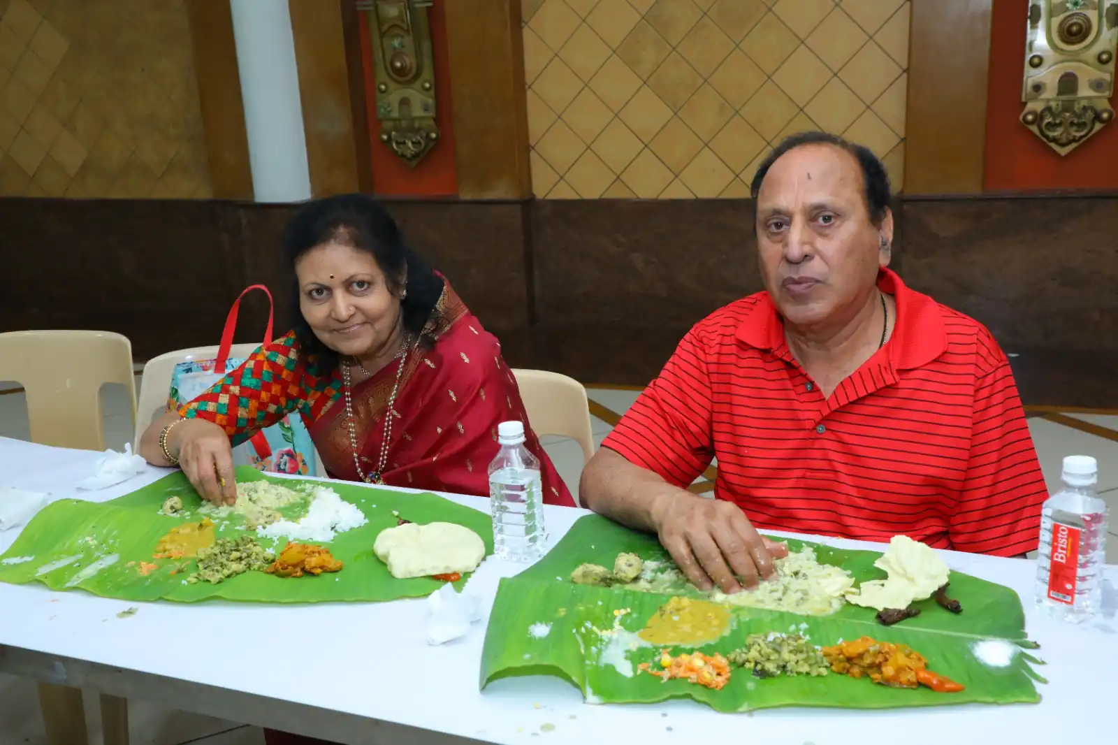 Guests enjoying banana leaf lunch with authentic Andhra dishes