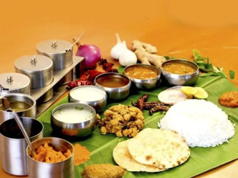 Authentic Andhra style vegetarian meal served on banana leaf with rice, pappu, sambar, rasam, curries and pachadi