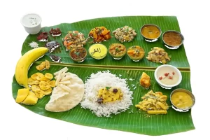 Traditional banana leaf vegetarian catering meal with white background for price estimation in Bangalore
