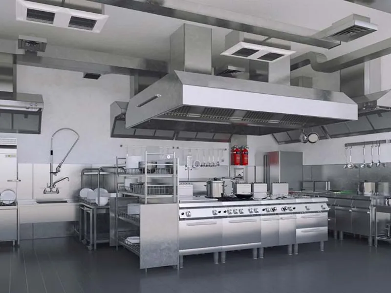 Professional catering kitchen with modern commercial cooking equipment and hygienic setup
