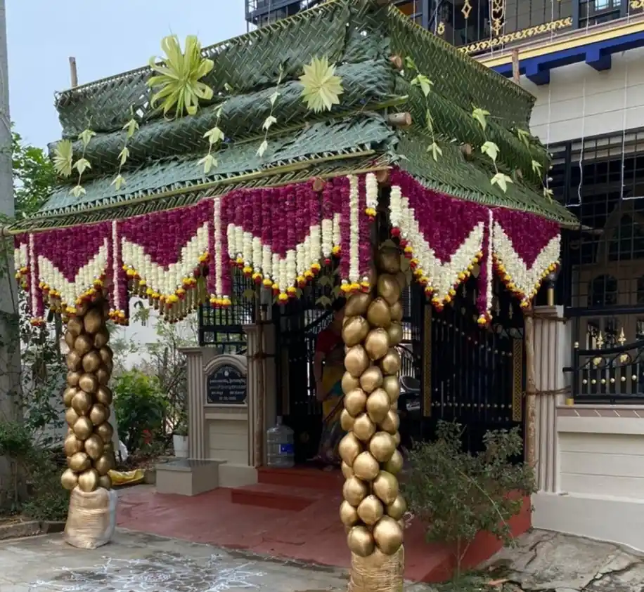 Traditional chappara entry floral decoration with banana leaves and fresh flowers for gruhapravesham