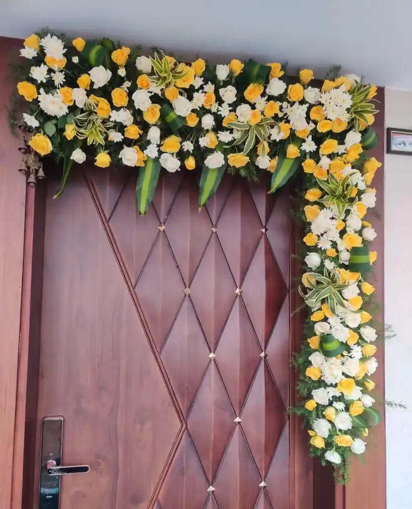 Fresh flower bedroom door decoration for gruhapravesham ceremony in Bangalore