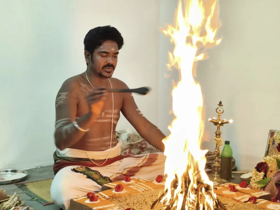 Pandit performing gruhapravesham pooja with homam