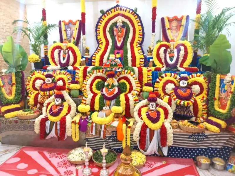 Colorful gruhapravesham puja flower decoration with marigold and jasmine