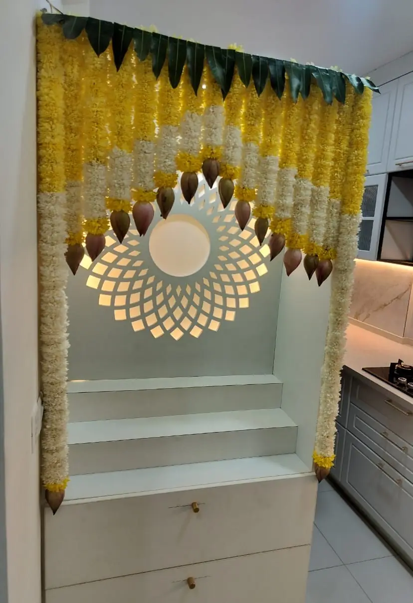 Floral design for gruhapravesham puja room decoration in Bangalore