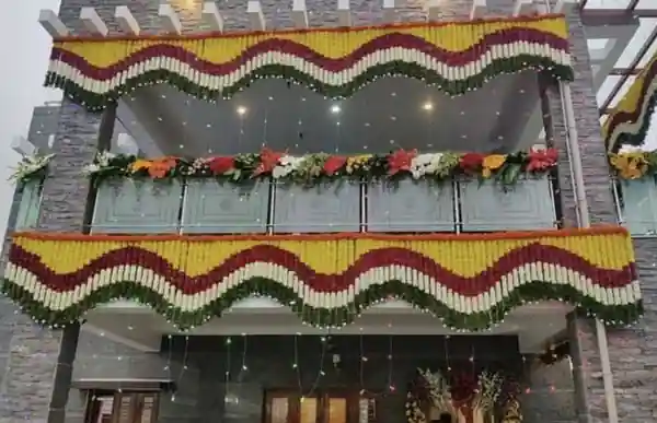 House warming balcony decorated with fresh flowers and floral borders