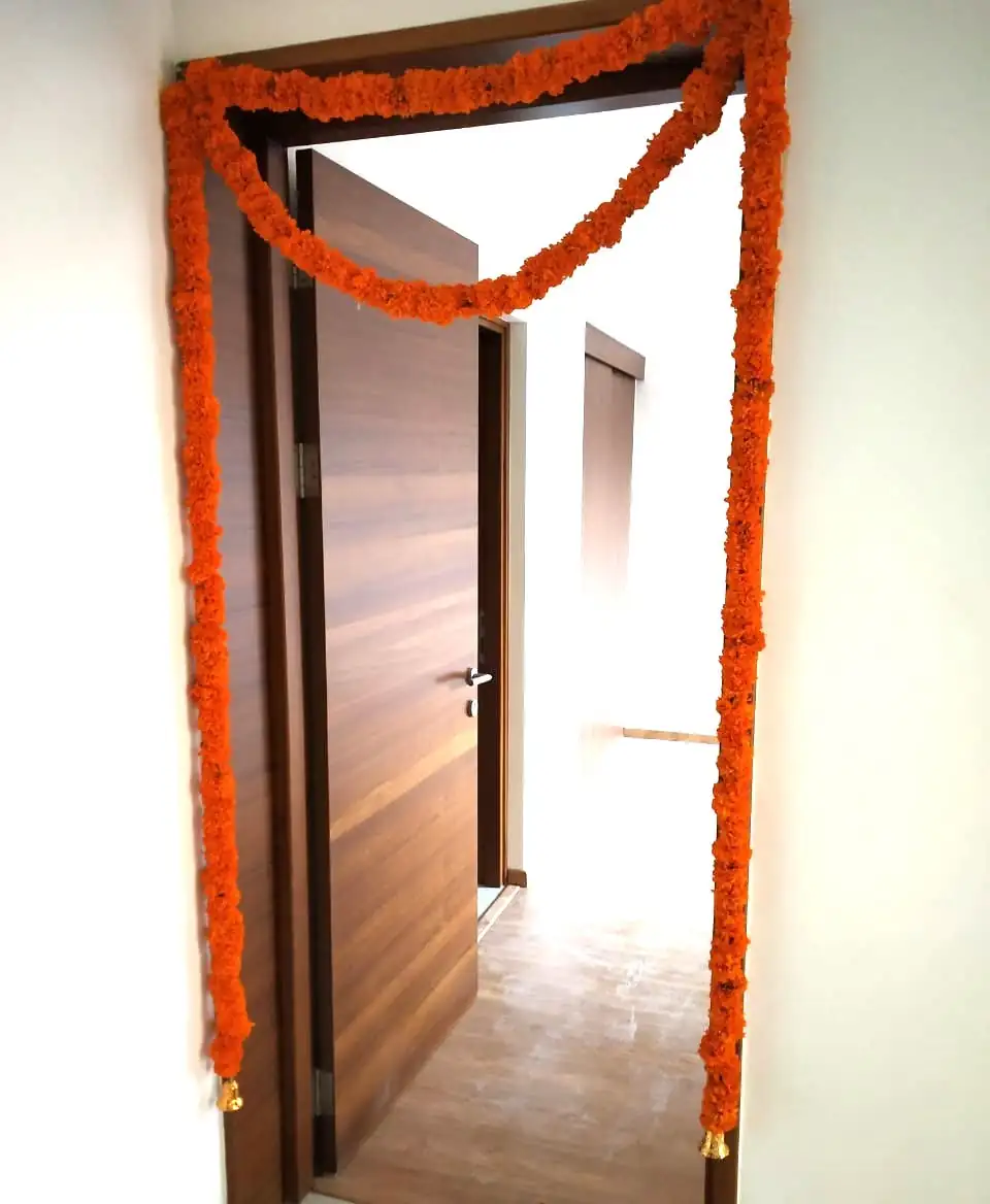 Beautiful floral design for bedroom door decoration during house warming in Bangalore.