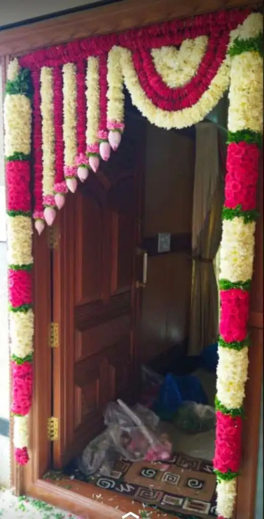 Fresh flower setup for house warming main door decoration in Bangalore