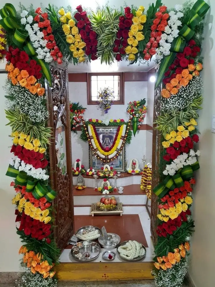 Housewarming pooja room flower decor with traditional floral garlands and sacred setup