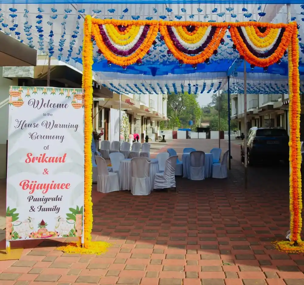 House warming welcome board with fresh flower decoration