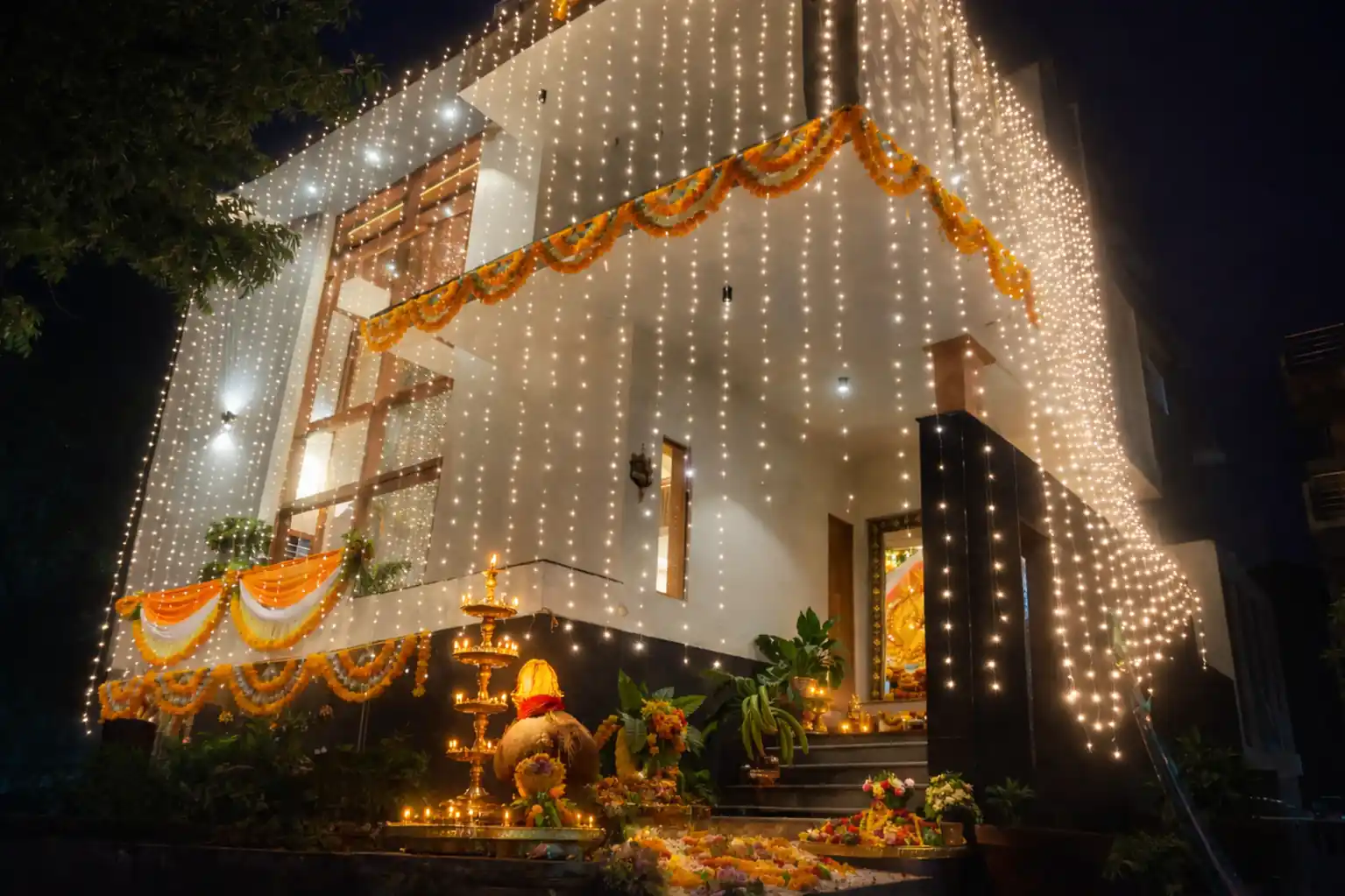 Housewarming entrance decoration with lights and flowers