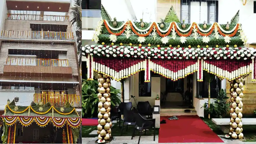 Traditional housewarming flower decoration at home entrance in Bangalore with marigold garlands and floral mandap design