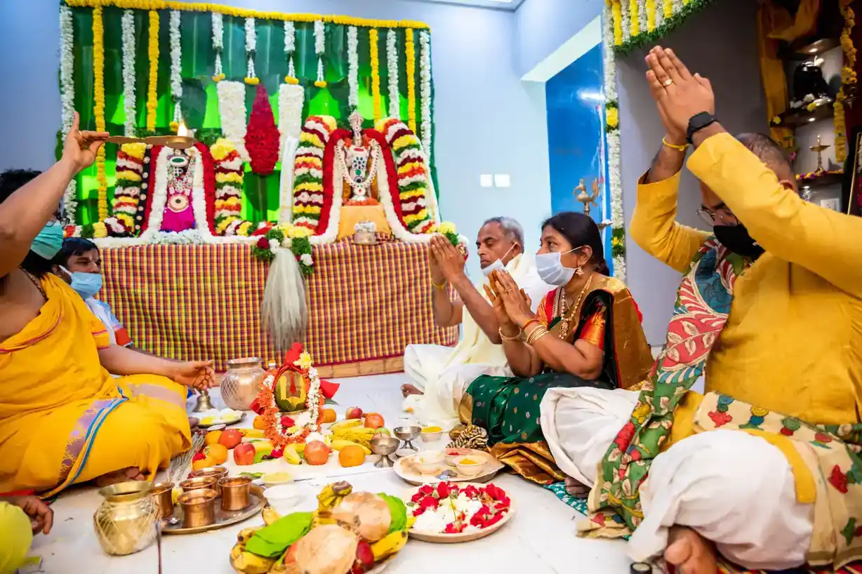 Gruhapravesham pooja photoshoot with priest and family