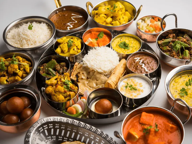 North Indian vegetarian catering menu with paneer curry, dal, rice, roti, gulab jamun and mixed vegetable dishes