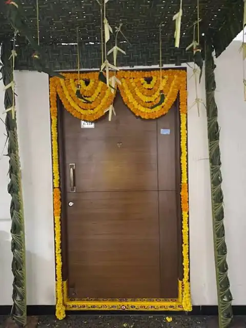 Simple chappara flower decoration for apartment housewarming ceremony in Bangalore