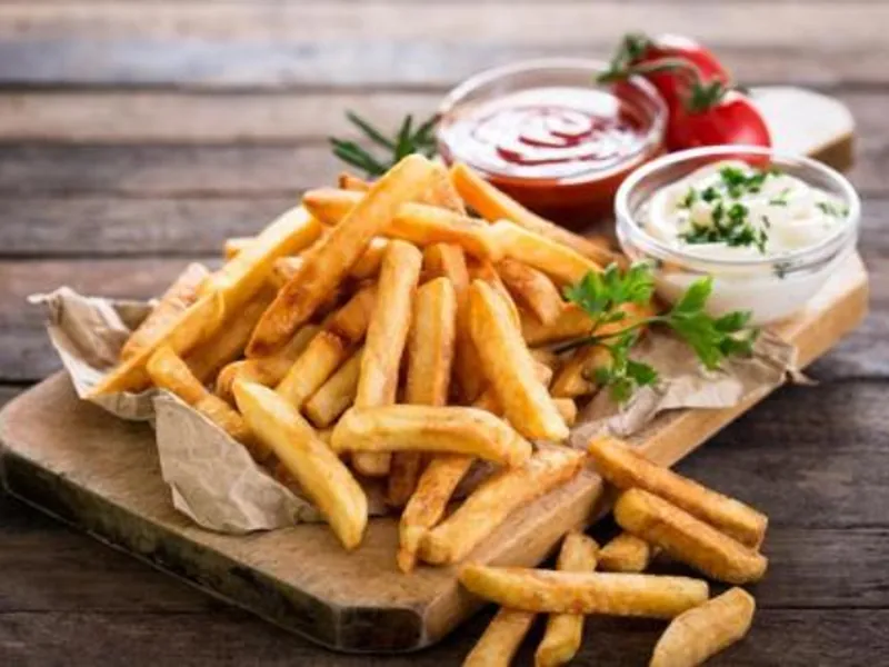 Crispy snacks catering menu with French fries and dipping sauces served for parties and events