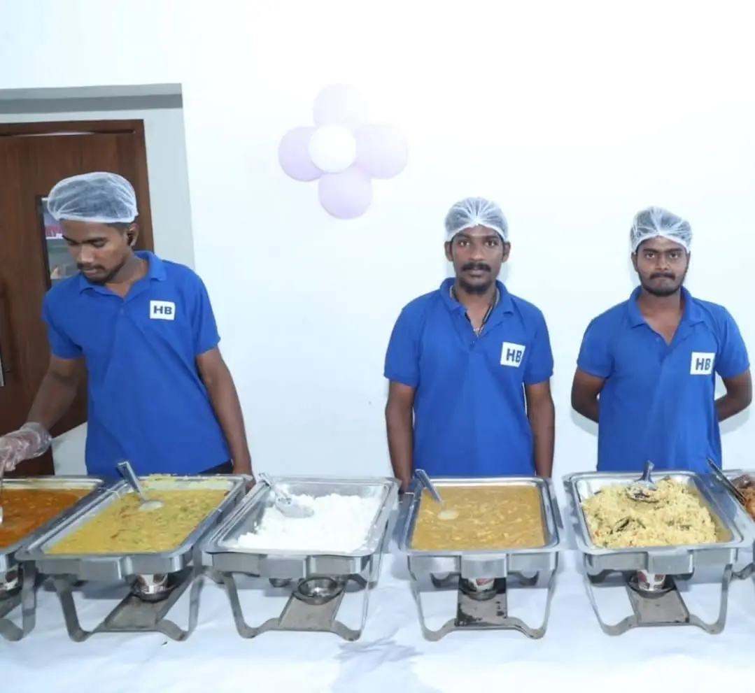Vegetarian buffet catering setup for griha pravesh ceremony in Bangalore with professional service staff.