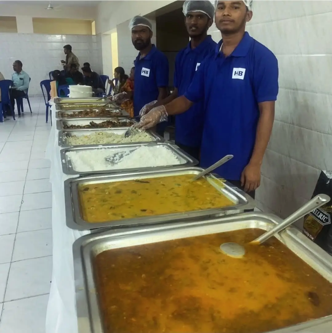 Guests enjoying veg buffet food during housewarming ceremony in Bangalore.