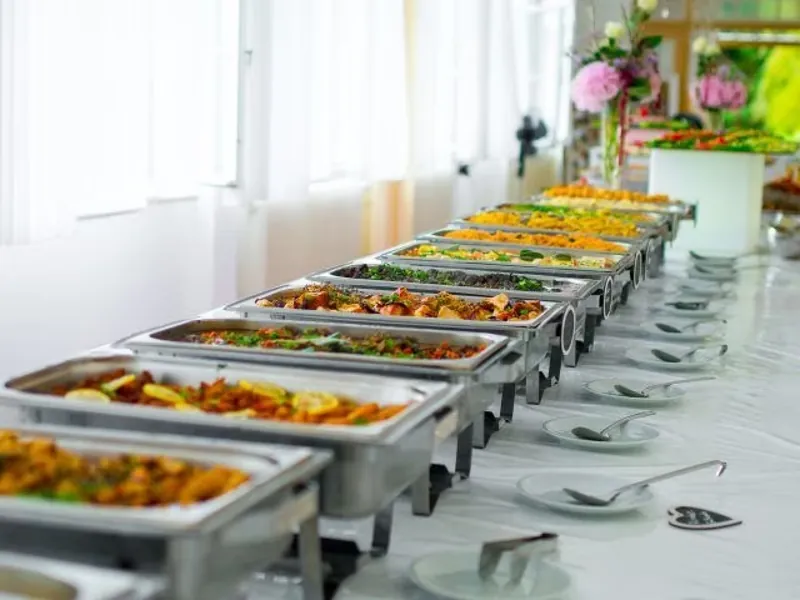 Professional vegetarian buffet setup with multiple food counters arranged for event catering