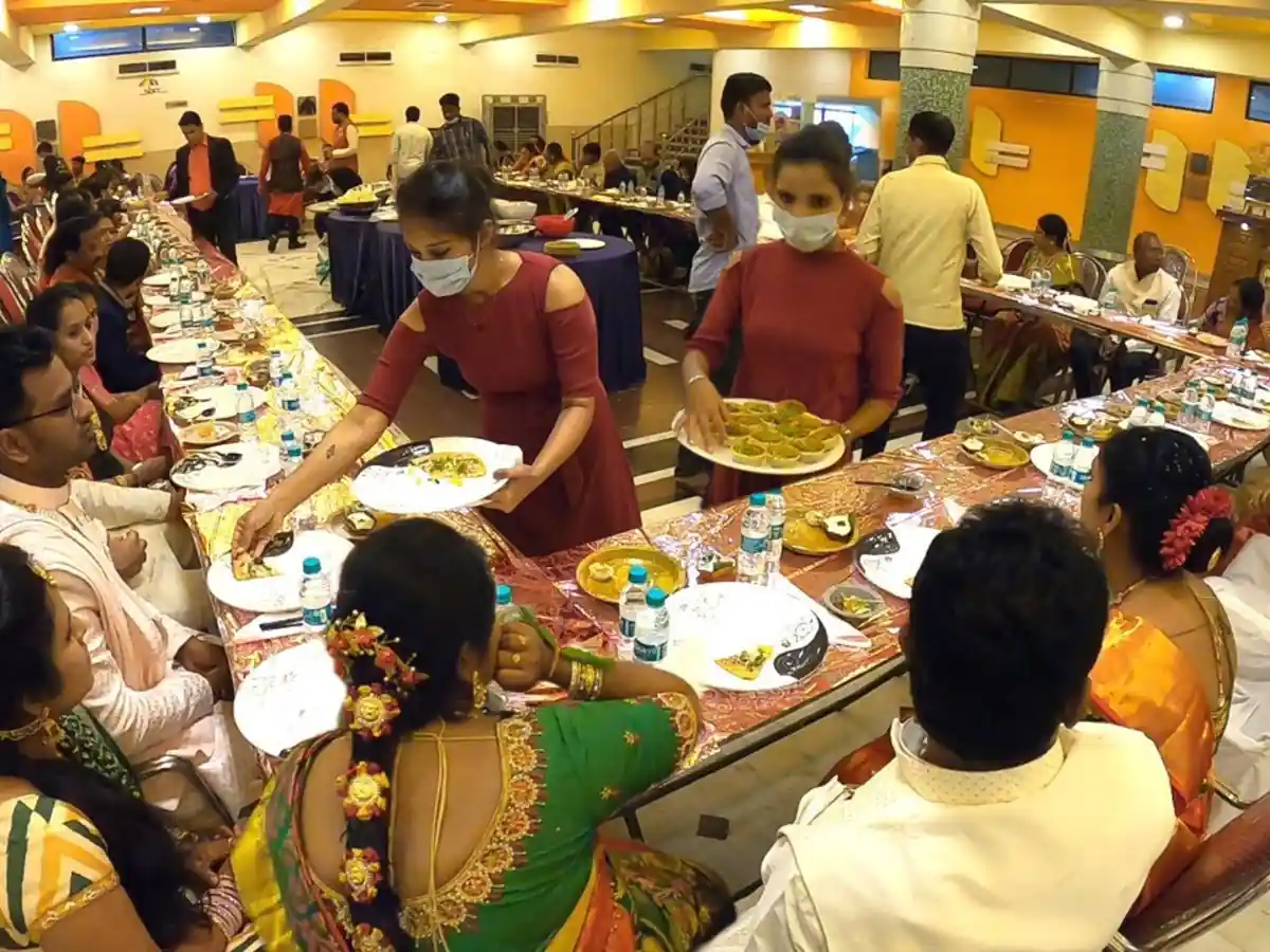 Wedding lunch service in Bangalore serving traditional vegetarian meals on banana leaf for wedding functions
