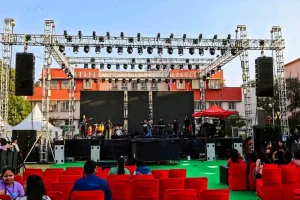 Outdoor college fest stage setup with lighting and audience seating arranged by college event organisers in Bangalore