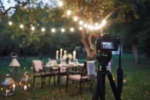Professional camera setup capturing outdoor evening event with decorative lights