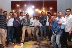 Friends enjoying a reunion celebration organised by get together event organisers in Bangalore