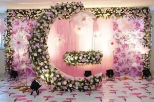 Elegant floral naming ceremony stage decoration with swing setup organised in Bangalore