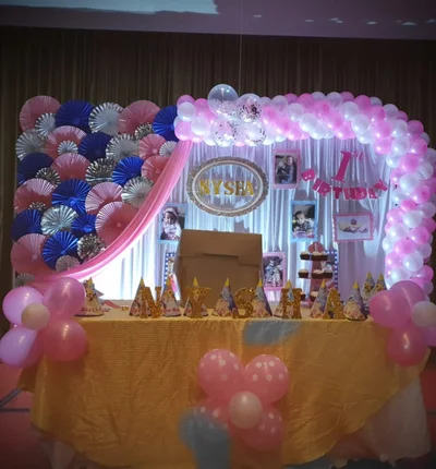 Pink and white balloon birthday party decoration setup by Hiibangalore event planners in Bangalore