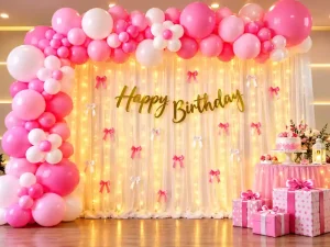 Pink and white balloon birthday backdrop decoration with fairy lights in Bangalore