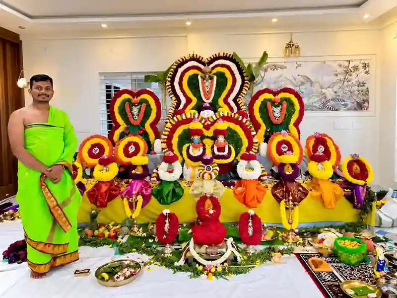 Pandit performing traditional pooja rituals for a housewarming ceremony in Bangalore
