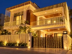 Villa decorated with traditional mirchi string lights for a housewarming ceremony in Bangalore