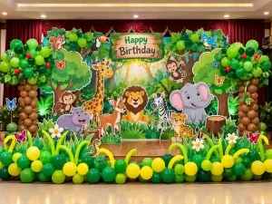 Jungle theme kids birthday decoration with animal cutouts and green balloon trees in Bangalore